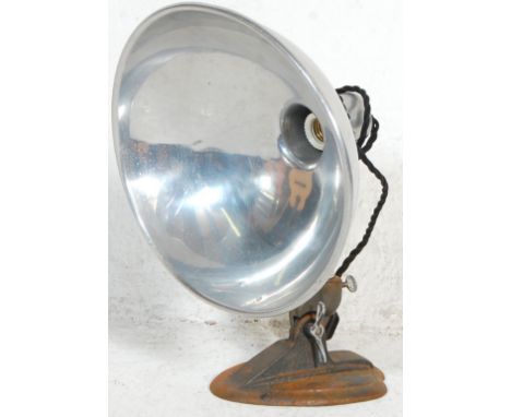 A Retro Vintage desk lamp set on a triangular cast iron base with a fully 360° adjustable stem with a large metal shade. Stam