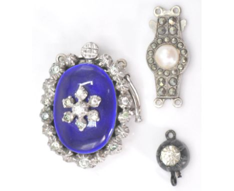 A collection of vintage silver and enamel set clasps to include Victorian single stone, larger enamel and rhinestone hallmark