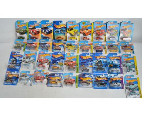 Thirty six factory sealed/unopened Hot Wheels Morris Mini diecast models with 18 different styles of car including Pop-Offs, 