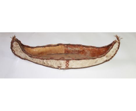 Native American scale model teaching aid for constructing a birch bark canoe, traditionally passed down from father to son. W