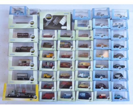 Fifty boxed 1/76 scale (OO gauge) vehicle models from Oxford Diecast's Commercials, Construction and Automobile Company range