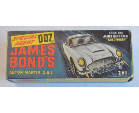 Vintage boxed Corgi Toys 261 James Bond gold coloured Aston Martin DB5 in full working order with box, secret instructions, s