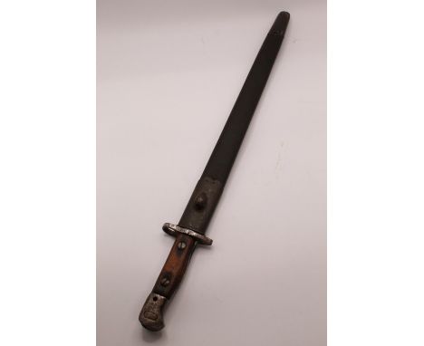 British 1907 Mk I bayonet, complete with original scabbard. With Wilkinson Sword maker's mark, inspector's mark, and bend tes