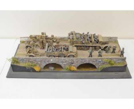 Well made and highly detailed 1/35 scale plastic model WWII diorama, depicting German armour crossing bridge with Famo, 88mm 