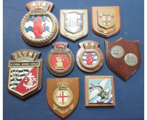 Collection of military and civilian metal and ceramic mounted wall plaques including H.M.S. Ulster, The Guild of Freemen of t