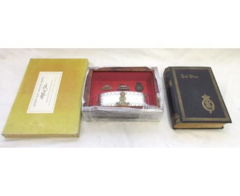 An Edwardian hallmarked silver officer's pouch mounted in display case, with two cap badges for The Queen's Own Hussars and o