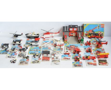 Twenty six unboxed vintage Lego Police, Fire and Ambulance sets all C1970-80's plus boxed set 6358, fire station set 6382 etc