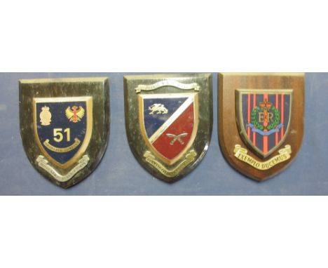 Collection of military and civilian metal and ceramic mounted wall plaques to include the Command Pay Office of Hong Kong, H.