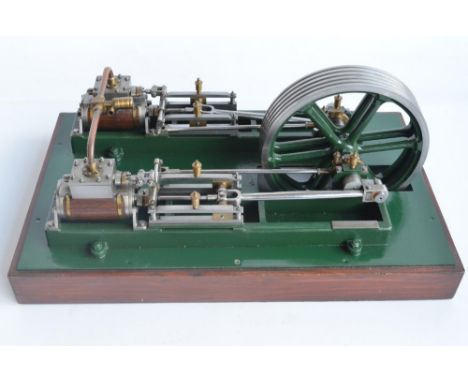 Twin cylinder horizontal stationary live steam engine with wood clad cylinder housings on wood plinth, no makers marks (in st