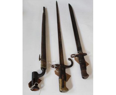 Selection of three bayonets in fair condition, including a 1913 pattern Remington bayonet (blade L4cm) without scabbard, an u