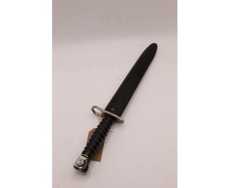 Swiss M1957 bayonet, complete with original plastic scabbard. Victorinox 'V' above serial no. and three mould marks to scabba