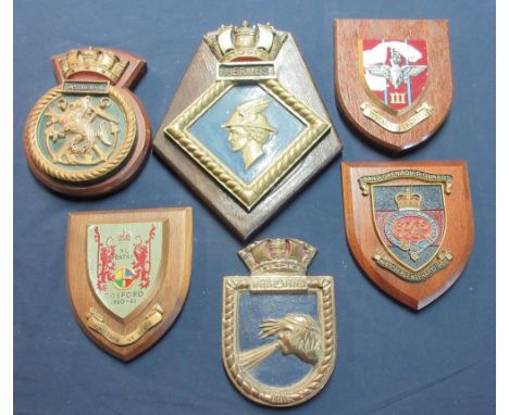 Collection of military and civilian metal and ceramic mounted wall plaques to include H.M.S. Whirlwind, Eastbourne, Hermes, P