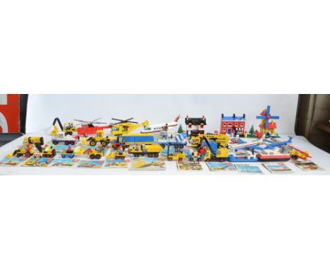 Twenty seven unboxed vintage Lego sets, C1970-80's to include construction, helicopters, aircraft, hovercraft etc plus comple