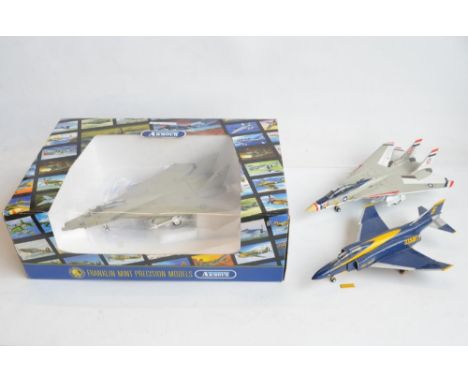 Three 1/48 scale diecast US Navy American fighters from The Armour Collection to include a boxed Grumman F-14A Tomcat and ano