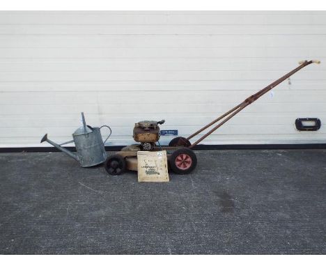 A lot to include a lawn boy 1958 model 7150 21 inch lawn mower with manual, a galvanised watering can and mixed lot of tools 