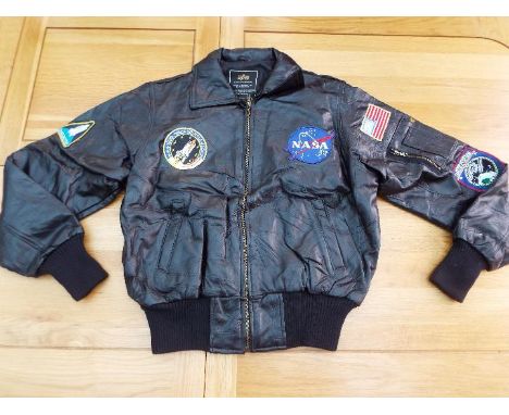 NASA - a black leather zip front jacket with five patch badges by Alpha Industries, official Defense Dept contractor, size M
