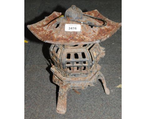 A cast metal pagoda hanging lantern. 