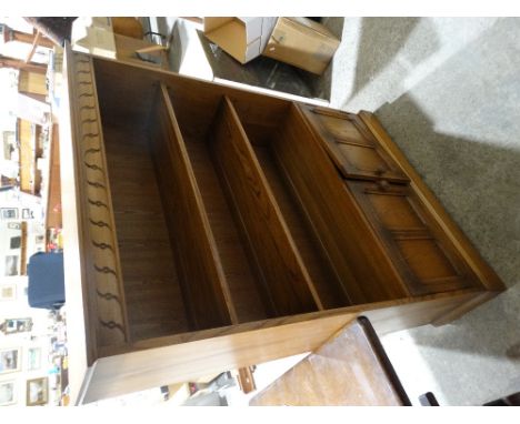 A Contemporary Ercol Medium Oak Bookcase Cabinet With Two Cupboards To The Base
