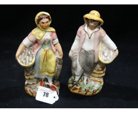 A Pair Of Staffordshire Pottery Fish Seller Figures