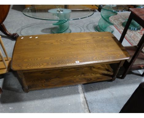 An Ercol Medium Oak Two Tier Coffee Table On Turned Supports