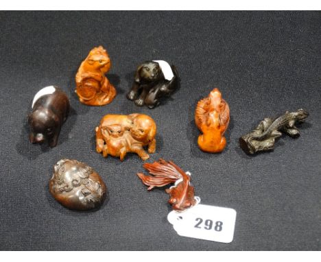 A Group Of Eight Carved Wooden Netsuke`s