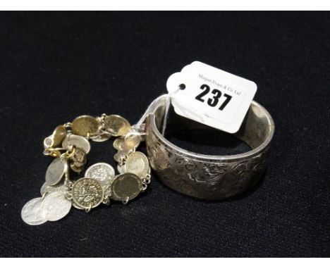 A Silver Bangle Together With A Silver Coin Bracelet