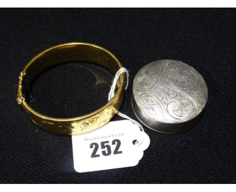 A Circular Silver Compact, Together With A Rolled Gold Bangle