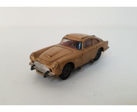 CORGI JAMES BOND ASTON MARTIN DB5 DIE CAST VEHICLEfrom the film Goldfinger, finished in gold, with functioning ejector seat a