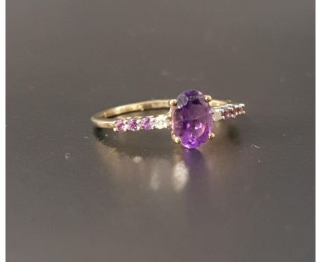 AMETHYST AND DIAMOND RINGthe central oval cut amethyst flanked by a diamond and three amethysts to each shoulder, on nine car