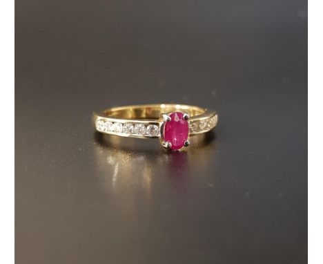 RUBY AND DIAMOND RINGthe central oval cut ruby approximately 0.35cts flanked by channel set diamonds totaling approximately 0