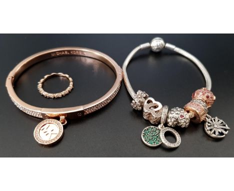SELECTION OF FASHION JEWELLERYcomprising a Pandora Moments smooth silver clasp charm bracelet with five charms, one spacer an