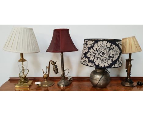 FIVE ASSORTED TABLE LAMPSincluding a steel lamp raised on a circular base with a burgundy shaped shade, 52cm high, a glass an