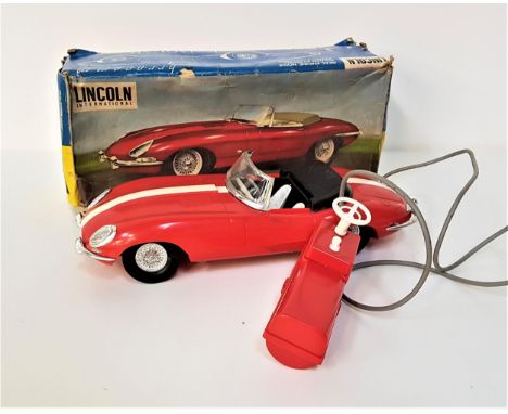E TYPE JAGUAR MODEL CARby Lincoln International with remote control and power steering, in red plastic with a white stripe, i