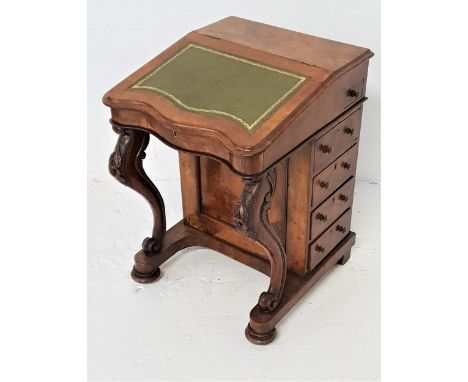 VICTORIAN WALNUT DAVENPORTwith a lift up lid inset with a green leather, the interior with two drawers above a dummy drawer, 