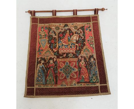 TAPESTRY WALL HANGINGdepicting a medieval man on horseback, and ladies in period dress, with four hanging loops on a turned p