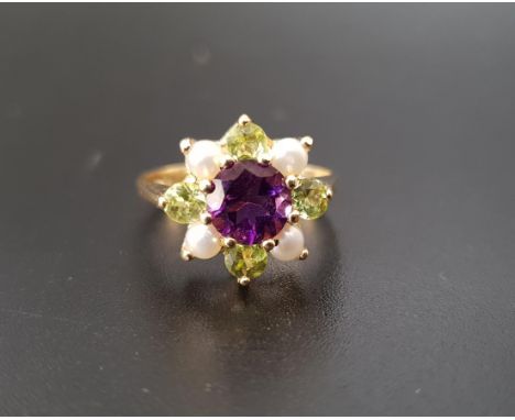 PRETTY 'SUFFRAGETTE' CLUSTER RINGthe central round cut amethyst approximately 1ct in peridot and pearl surround, the gemstone