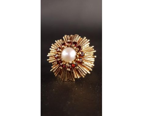 1970s GARNET AND PEARL DRESS RINGthe central pearl in garnet surround and starburst effect setting, in nine carat gold, ring 