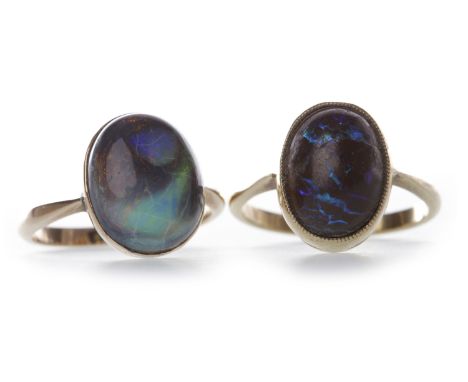 EDWARDIAN BOULDER OPAL SET RINGset with an oval cabochon cut section of boulder opal 13mm long, in a millegrain edged collet 