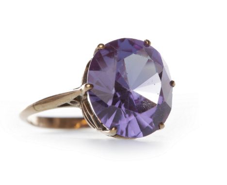 GEM SET DRESS RINGthe oval gem of approximately 12x10mm, in an unmarked rose gold setting, size J-K, 2.6g