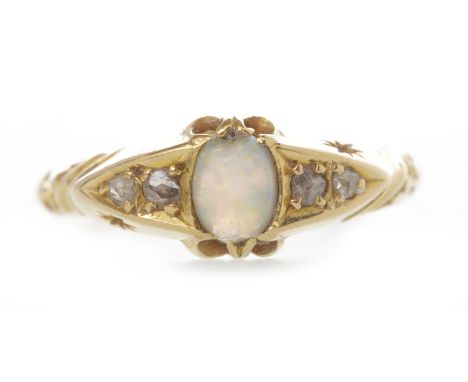 EIGHTEEN CARAT GOLD DRESS RINGset central opal flanked by two diamond chips to each side 