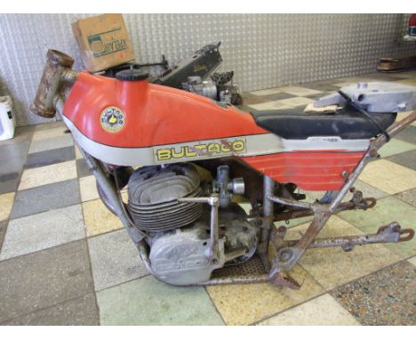 A Bultaco Sherpa trials project, comprising a frame, a tank/seat unit, an engine, a rear wheel, and sundry spares. No paperwo