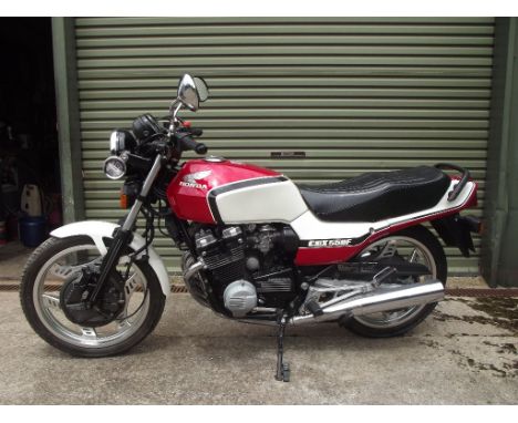 A 1988 Honda CBX 550 F II, registration number E696 WUB, frame number PC04000906, engine number PC04E1000816, red and white. 