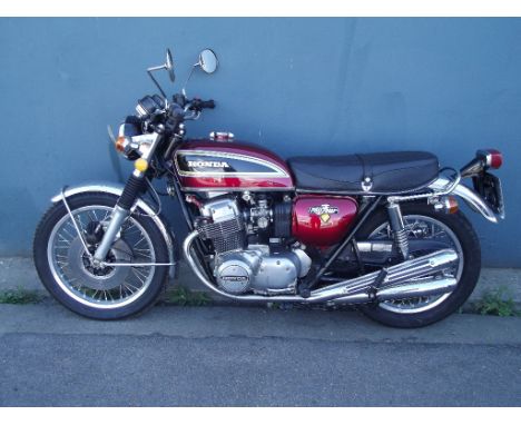A 1977 Honda CB750/Four E, registration number YGJ 866S, frame number CB7502583445, engine number CB750E2558995, red. This pa