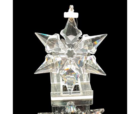 Clear faceted crystal annual ornament created with 6-pointed star design. Blue satin ribbon included for hanging. Swarovski b