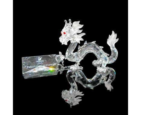 Part of the Annual Edition 1997 Fabulous Creatures. Clear faceted figural holding crystal ball with red crystal eyes and fros