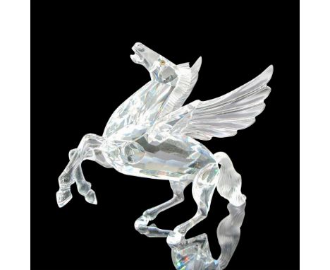 Clear faceted crystal body rearing up for flight has frosted tail and mane and amber eyes. Swarovski backstamp. This item has
