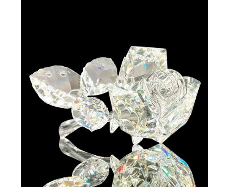 Sparkling faceted and molded crystal figurine modeled as a rose with leaf and stem. Swarovski acid marks. This item has its o