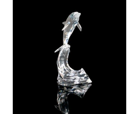 Stunning faceted crystal dolphin with brilliant eyes jumping out of radiant smooth clear waves This item has its original box