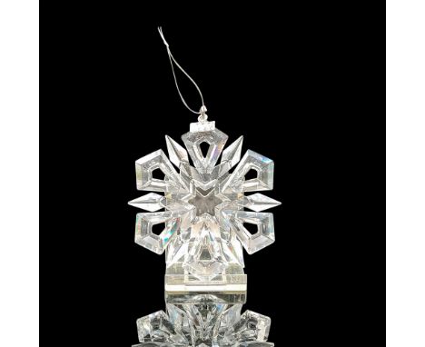 Clear round 12-pointed annual crystal ornament with blue satin ribbon for hanging. Swarovski backstamp. 9445 990 001. This it