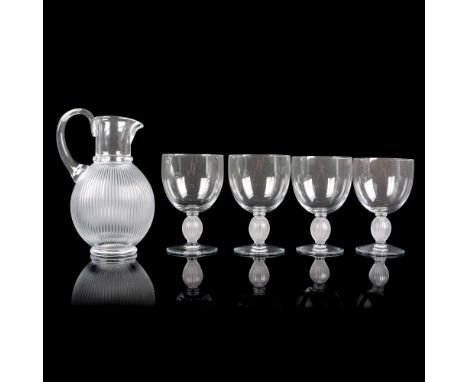 Clear neck and handle with vertical frosted vertical ribbed design on pitcher. Clear body on glass with frosted vertical rib 